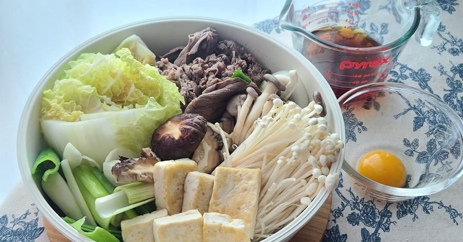 Sukiyaki: Japanese hot pot with beef, tofu, rice noodles and vegetables